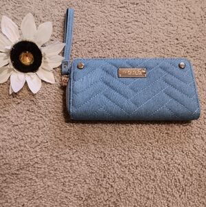 bebe Quilted Light Blue Wristlet Wallet with Gold Bebe Plate.